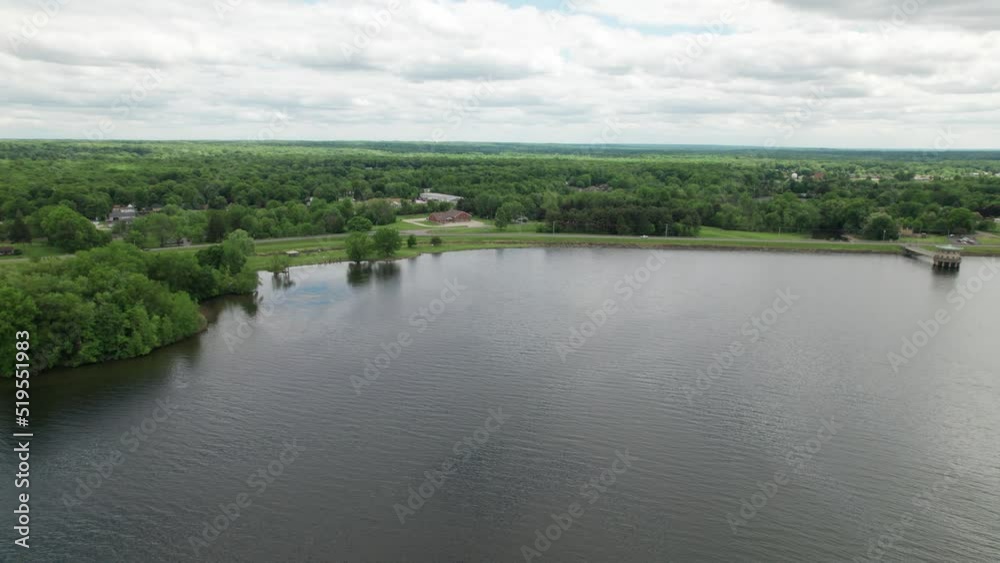 Aerial panoramic view of the lake and forest landscape on the side of a road Aerial panoramic view of the lake and forest landscape on the side of a road