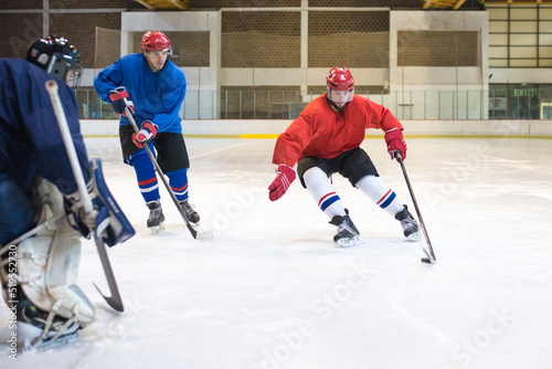 Photography Ice hockey players playing ice hockey in the ice rink in winter