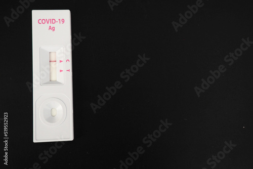 Covid-19 test on a black background. Negative result for virus with copy space