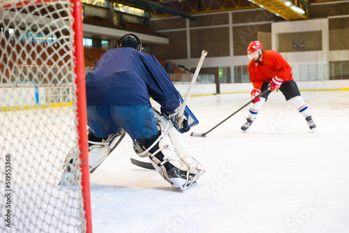 Photography Ice hockey players playing ice hockey in the ice rink in winter