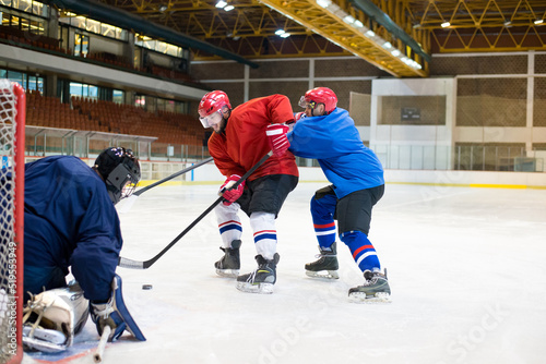 Photography Ice hockey players playing ice hockey in the ice rink in winter