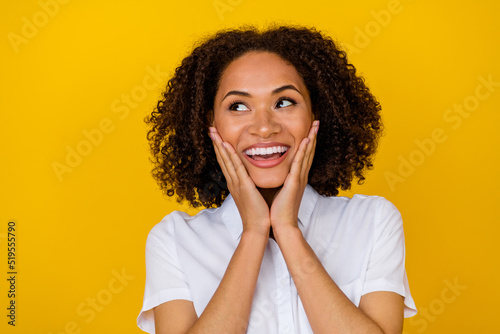 Photo of pretty girl beaming smile trendy outfit arms palms touch cheeks glad see discount good news isolated on yellow color background