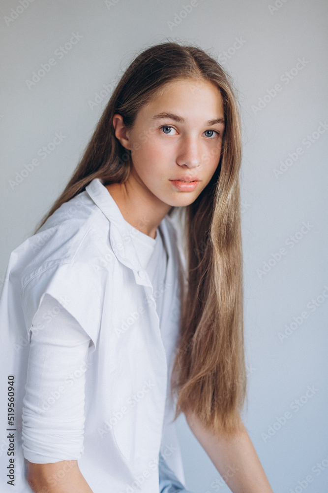 Young blondie caucasian girl on white background. Natural beauty, no make up, casual lifestyle girl Young blondie caucasian girl on white background. Natural beauty, no make up, casual lifestyle girl