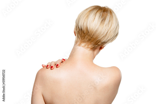 Image of female back isolated over white studio background. Pains in spine. Medical treatment with pills and massages