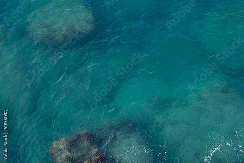 Top view of blue frothy sea surface. Shot in the open sea from above.