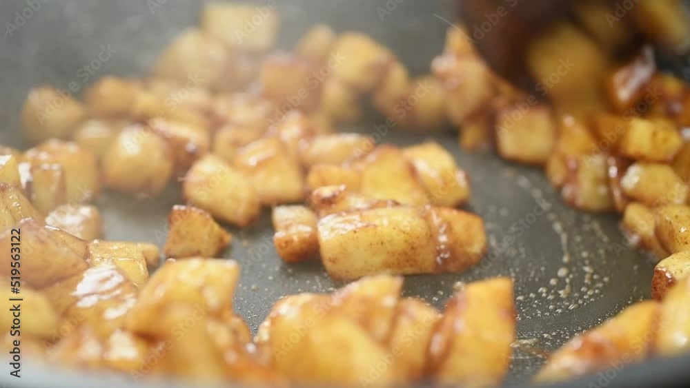 Cooking of pieces apples with butter, brown sugar and cinnamon.
Cooking of pieces apples with butter, brown sugar and cinnamon.