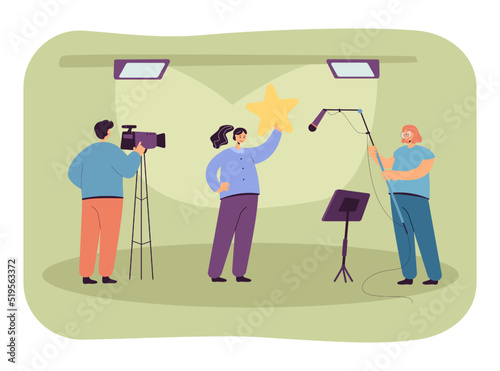Studio shooting with presenter, cameraman and boom operator. Female journalist holding big star flat vector illustration. Television, broadcasting concept for banner, website design or landing page