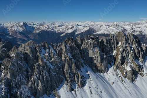 High mountains in Italy covered in snow on a sunny day