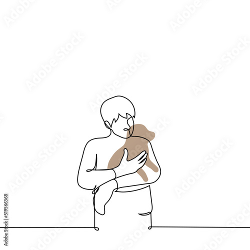man stands holding a puppy in his arms - one line drawing vector. the concept of a dog lover, the owner of the dog lovingly holds and cuddles the pet