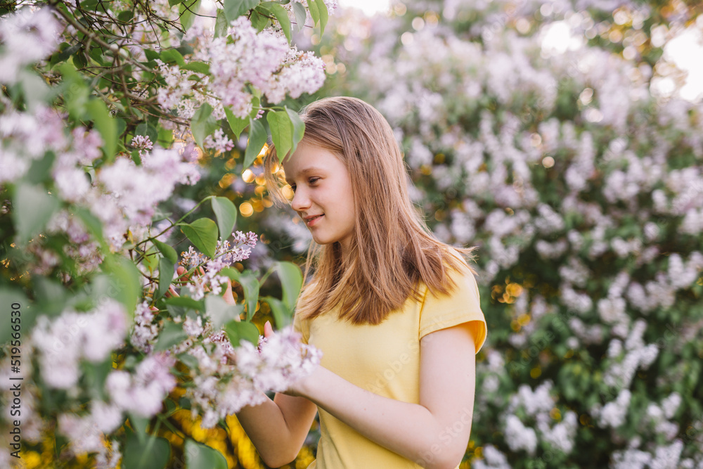 teenage girl with blond hair enjoys nature. The girl is wearing a yellow summer dress. teenage girl with blond hair enjoys nature. The girl is wearing a yellow summer dress.
