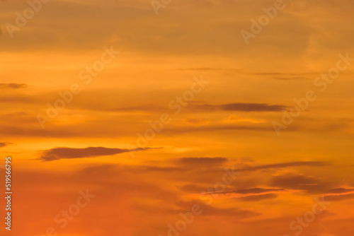 Sunset sky orange color clouds background nature in the evening summer © Andrey