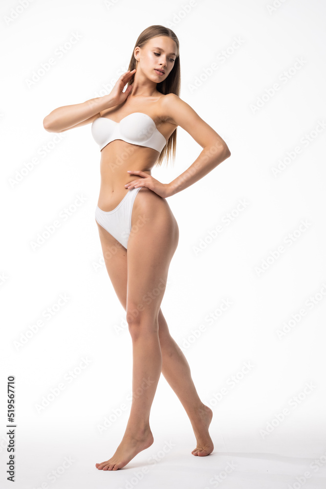 Beautiful woman with slim body in underwear is in the studio. Beautiful woman with slim body in underwear is in the studio.