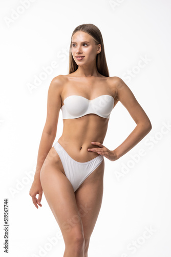 Beautiful fitness woman with a perfect body on white background