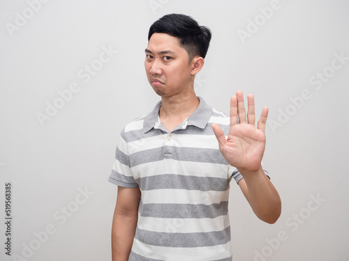 Asian man show hand stop say no,Man not agree isolated