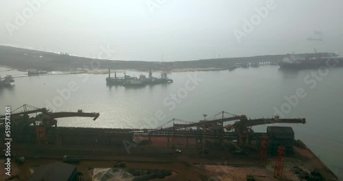 Big Industrial Equipments And Ships In Paradip Port In Orisha, India - aerial shot photo