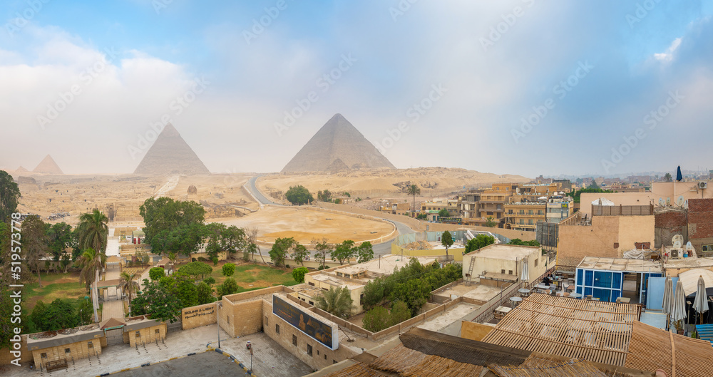 Giza, Egypt; August 16, 2022 - Sunrise at The Pyramids Of Giza, Egypt.