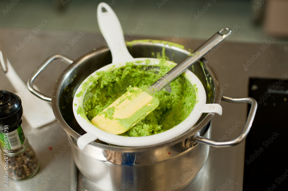 Cook cooks mashed peas. Cook cooks mashed peas.