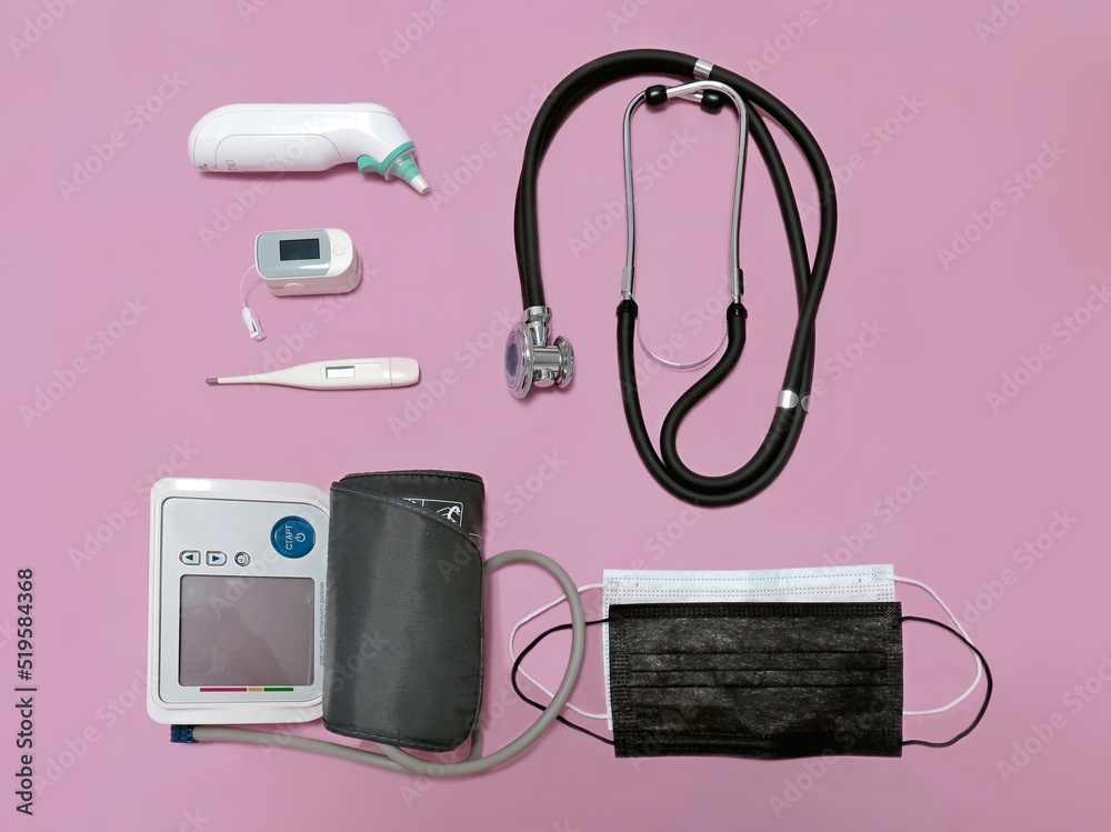 stethoscope, pulse oximeter, thermometers, blood pressure monitor, medical masks on a pink background
stethoscope, pulse oximeter, thermometers, blood pressure monitor, medical masks on a pink background