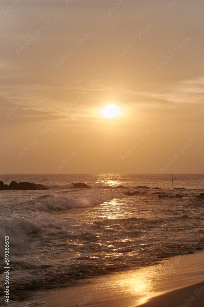 Ocean waves at sunset in Sri Lanka