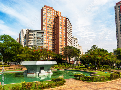 Central panorama of the city of Belo Horizonte. Raul Soares Square. Trees, fountain, blue sky and beautiful residential and commercial buildings.