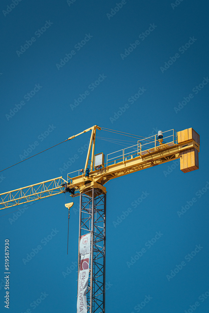 Yellow Crane over Blue Sky - Industrial Yellow Crane over Blue Sky - Industrial