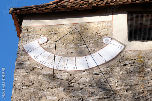 Close-up of the sundial on the wall of an old chapel on the Moritzberg in Germany on a sunny february day. photo