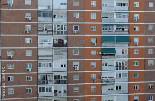 Facade of the residential building in the poor district of Madrid, Spain