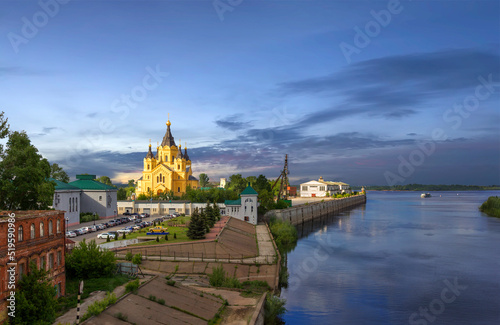 Panoramic view of the Volga River and the cathedral in the name of the holy prince Alexander Nevsky in the evening. Nizhny Novgorod, Russia. photo