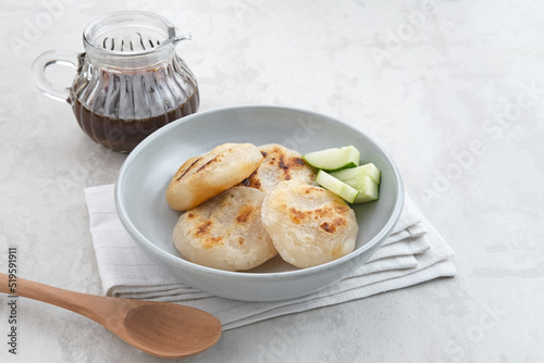 Pempek Tunu or Pempek Panggang, traditional food from South Sumatra, Indonesia. This fish-based food is very popular. Served with cuko sauce.
 photo