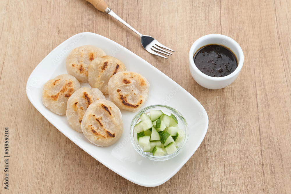 Pempek Tunu or Pempek Panggang, traditional food from South Sumatra, Indonesia. This fish-based food is very popular. Served with cuko sauce.
Pempek Tunu or Pempek Panggang, traditional food from South Sumatra, Indonesia. This fish-based food is very popular. Served with cuko sauce.