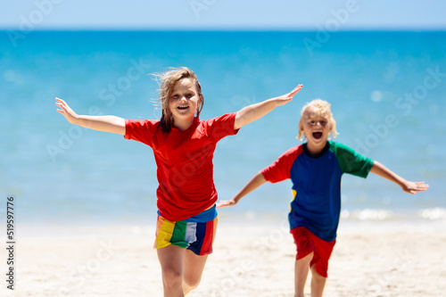 Kids playing on beach. Children play at sea.