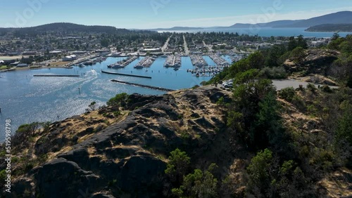 Aerial shot flying over Cap Sante Park's viewpoint and into the Anacortes boating marina. photo