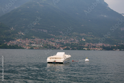 Boats and Boat dock on Lake Como, Italy from the town of Lezzeno- Varenna, Lombardy region, Europe, Alps photo