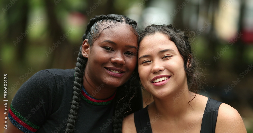 Naklejka premium Diverse girlfriends smiling at camera together. Ethnically diversity women