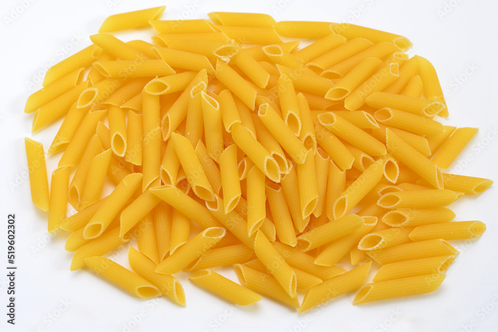 heap of pasta penne rigate durum wheat close up on white background heap of pasta penne rigate durum wheat close up on white background