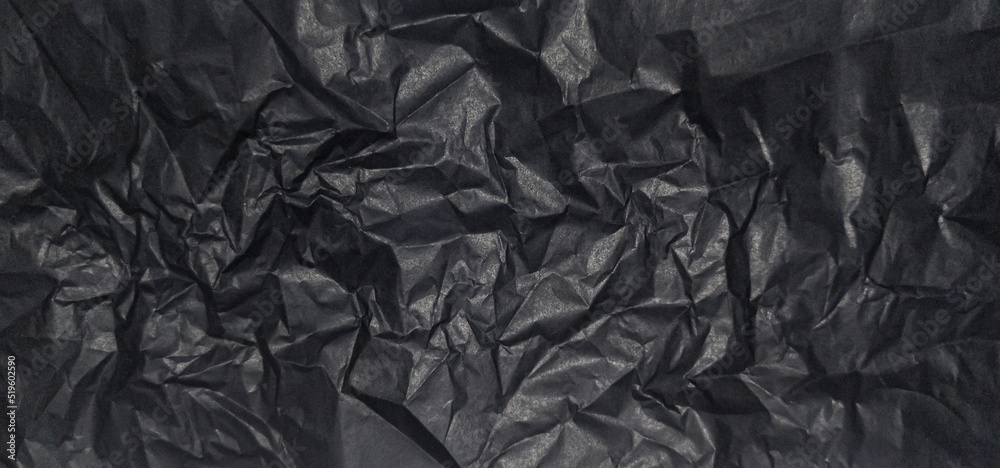 Close up of black wrinkle crumpled old with paper page texture rough background