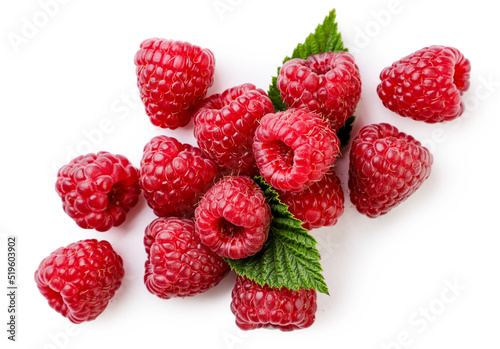 Fototapeta Raspberries with leaves close-up on a white background. Top view