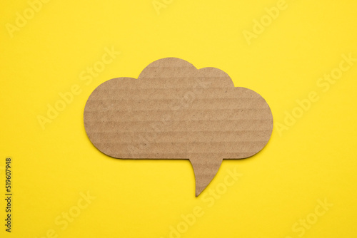 Speech bubble crepe paper balloon label on yellow background