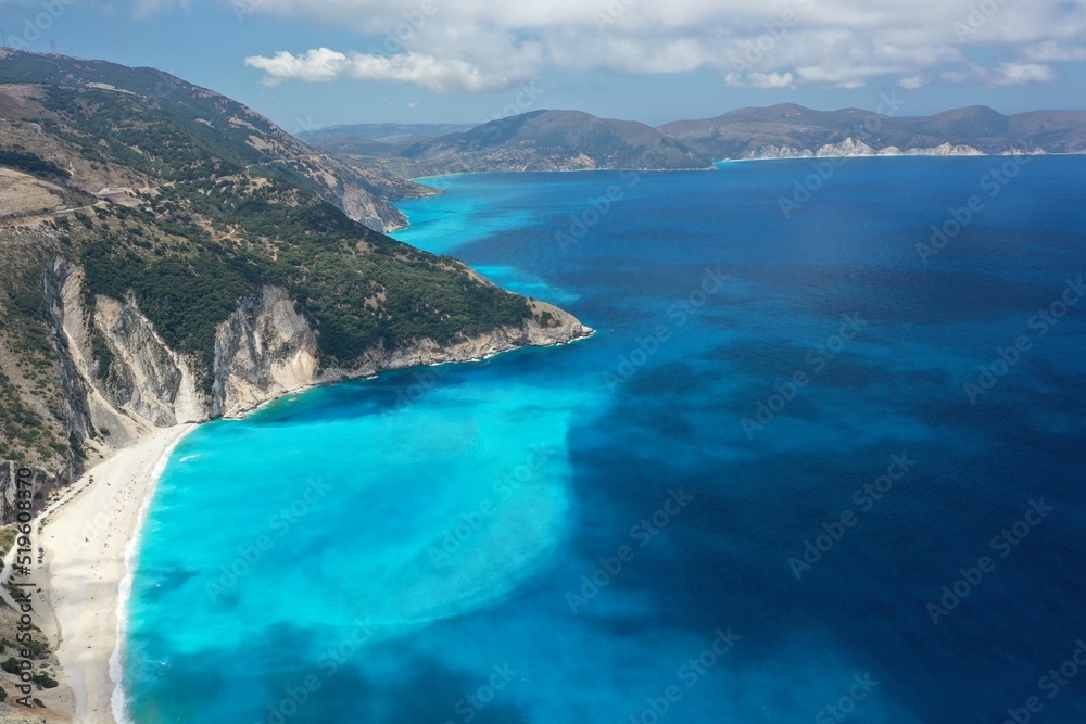 Blue turquoise ocean lagoon mediterranean rocky shore, drone aerial shot.. High quality image.