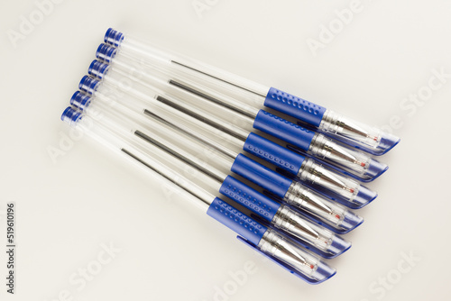 set of blue ballpoint pens lined up hardly © Aliaksei Luskin