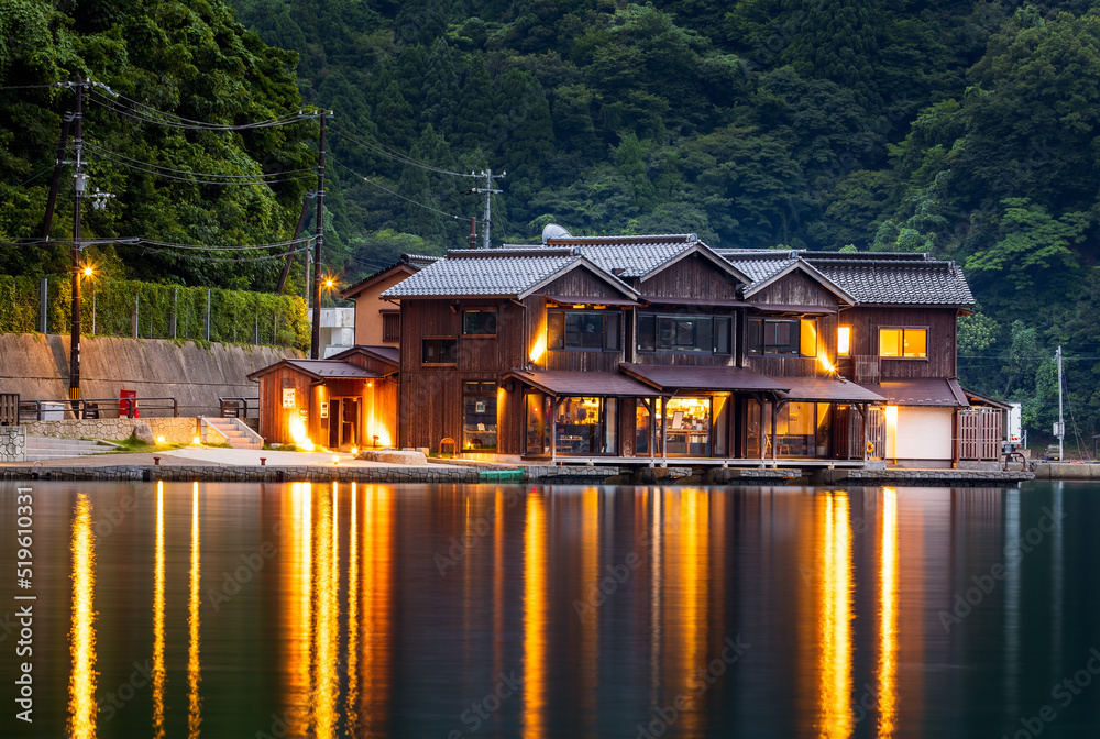 Lights from waterside restaurant reflect off water in early evening at Ine Lights from waterside restaurant reflect off water in early evening at Ine