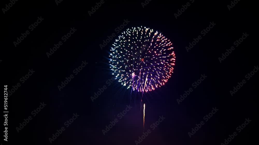 4K. loop seamless of real fireworks background. abstract blur of real golden shining fireworks with bokeh lights in the night sky. glowing fireworks show. New year's eve fireworks celebration.