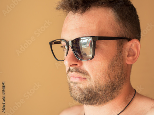 broken sunglasses bearded man