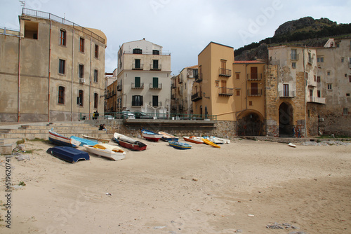beach and buildings in cefalu in sicilia (italy) 
