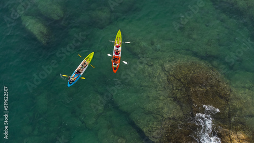 Top view of canoe. people boating in the sea.