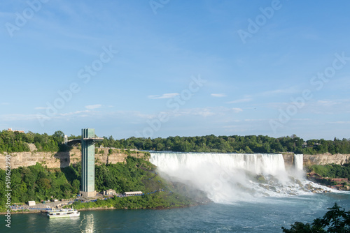 Niagara Falls, ON, Canada - July 23, 2022: Niagara Falls Observation Tower and falls on the U.S. side view from Niagara Falls, ON, Canada. 