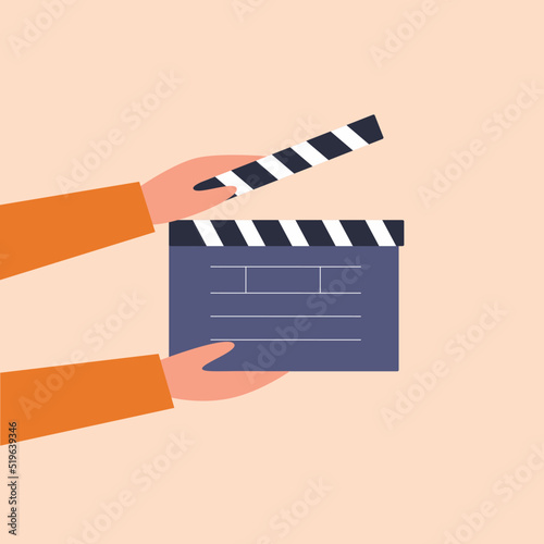 Cinematography concept.Hand holding movie clapper board. Vector illustration cartoon flat style