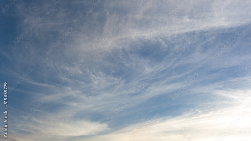 Fototapeta premium Beautiful blue sky over the sea with translucent, white, Cirrus clouds