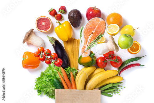 Healthy food background. Healthy food in paper bag fish, vegetables and fruits on white. Shopping food supermarket concept