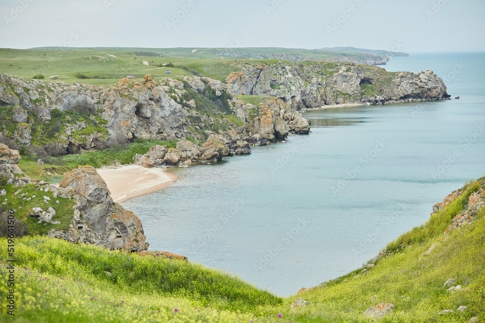The coast, with its wild cliffs, landscape with the sea or ocean.